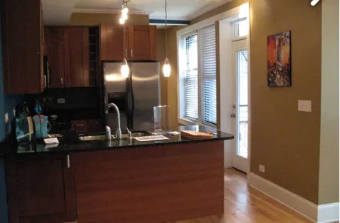 a kitchen with a sink and a refrigerator