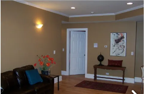 a living room with furniture and painting on the wall
