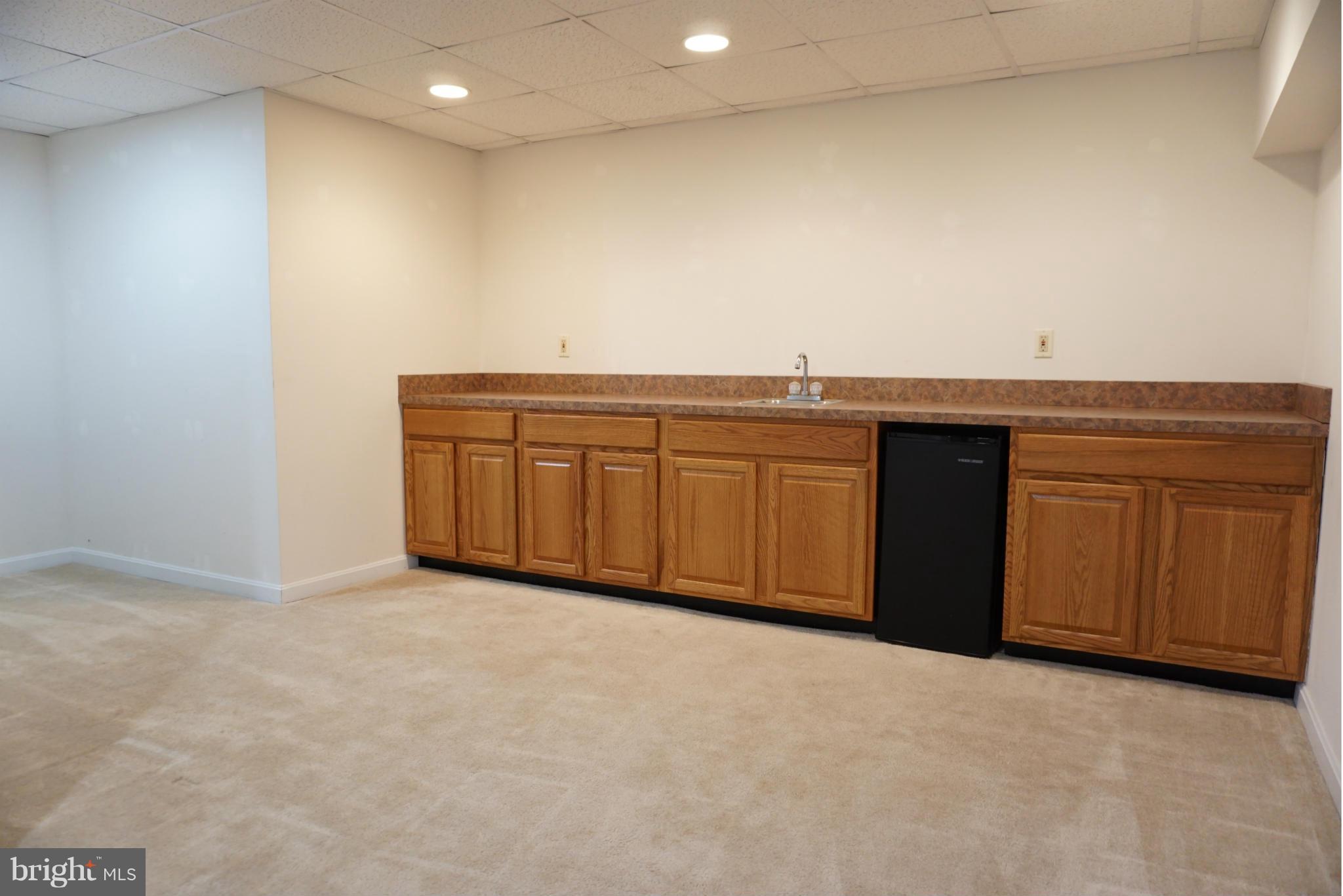 14405 Colonels Choice Road Upper Marlboro, MD 20772 - Photo 17 of 18 a view of kitchen with granite countertop cabinets and sink