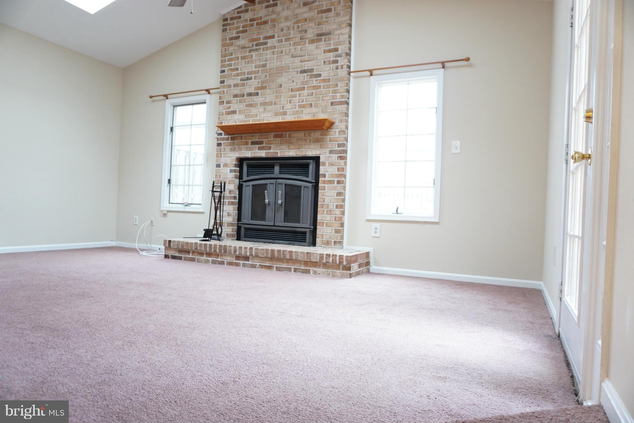 14405 Colonels Choice Road Upper Marlboro, MD 20772 - Photo 7 of 18 an empty room with a fireplace