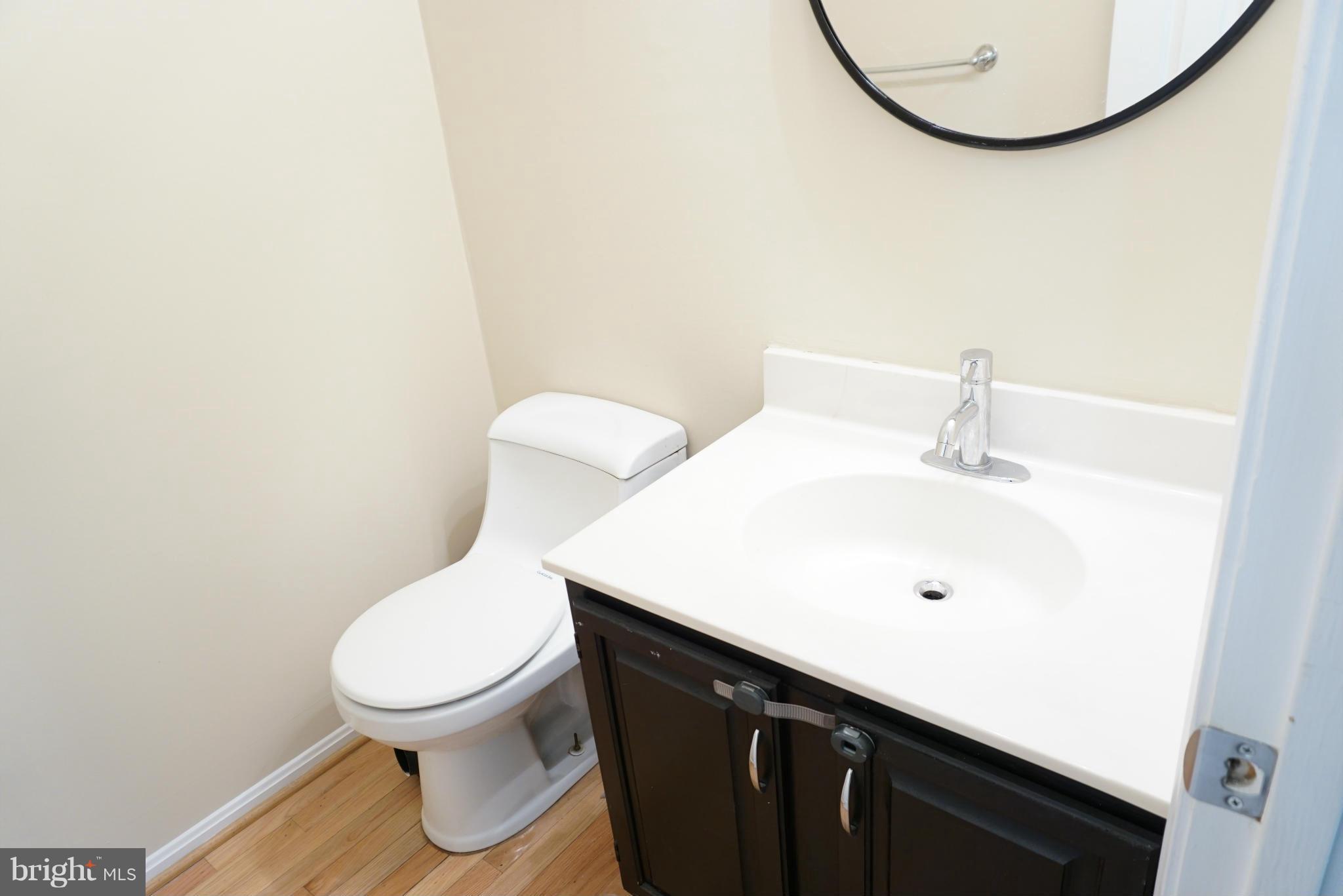 14405 Colonels Choice Road Upper Marlboro, MD 20772 - Photo 8 of 18 a bathroom with a sink and a toilet