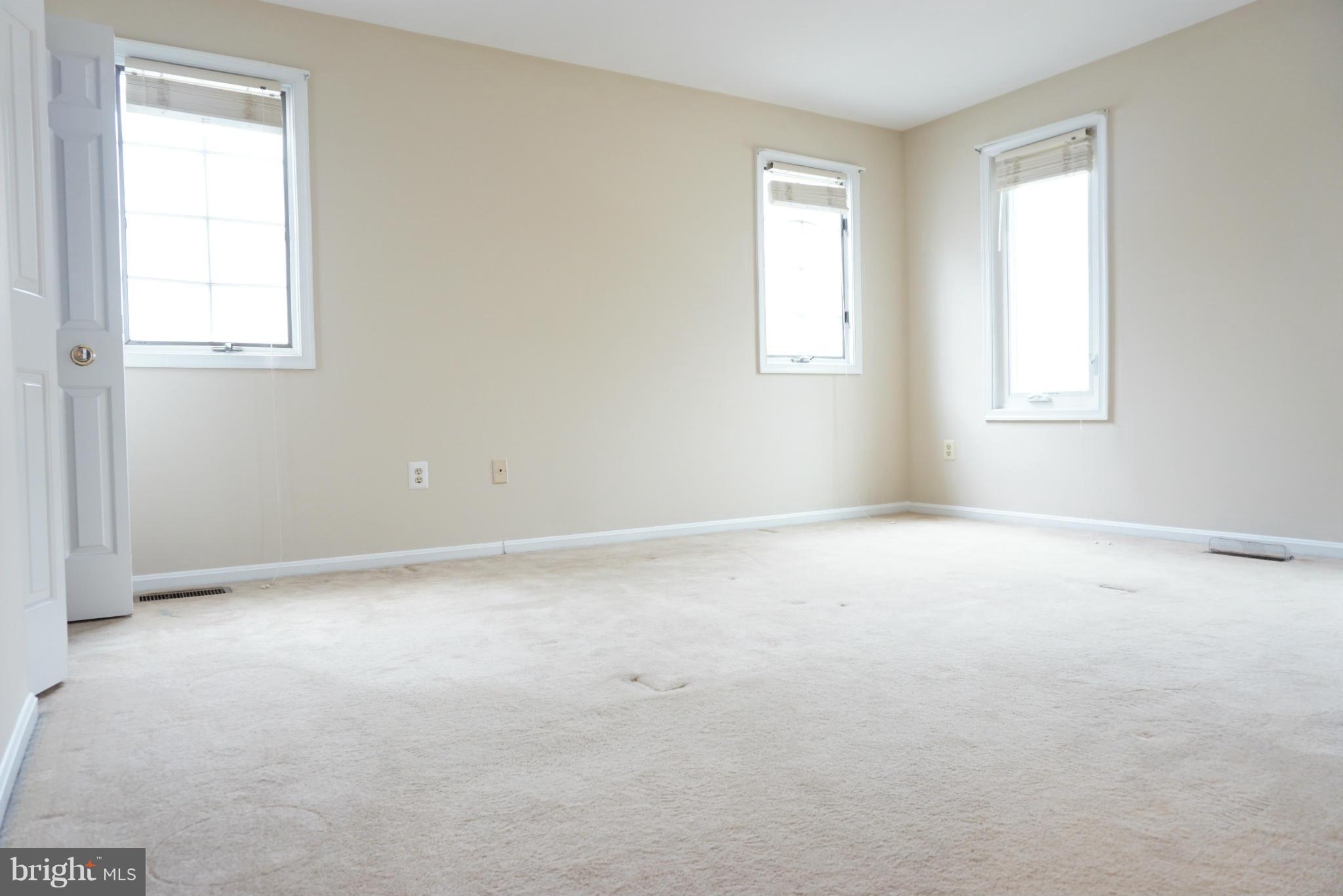14405 Colonels Choice Road Upper Marlboro, MD 20772 - Photo 9 of 18 an empty room with windows