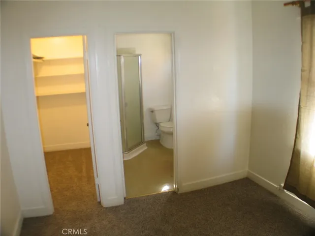 a view of balcony with wooden floor and outdoor seating