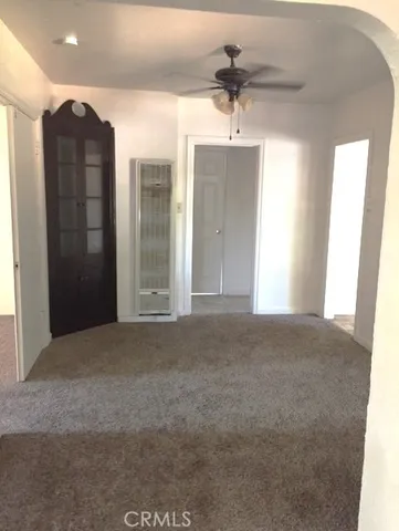 a view of a hallway with a chandelier