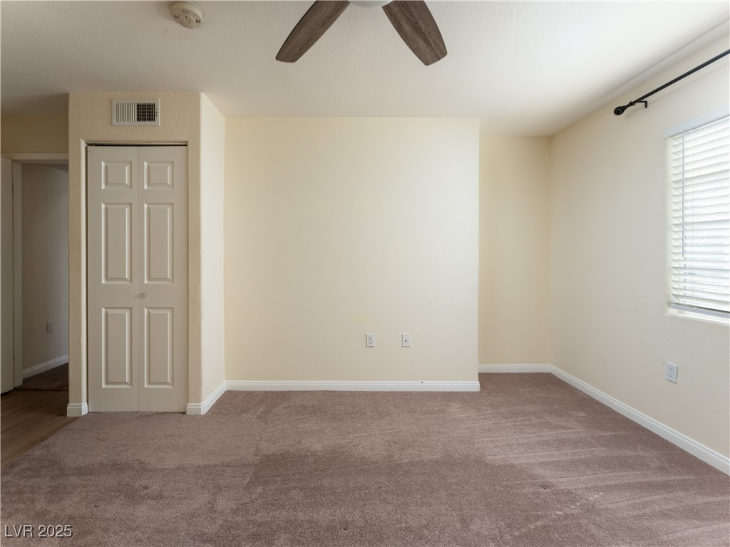 3318 North Decatur Boulevard, Unit 2149 Las Vegas, NV 89130 - Photo 19 of 26 Unfurnished room featuring carpet flooring and ceiling fan