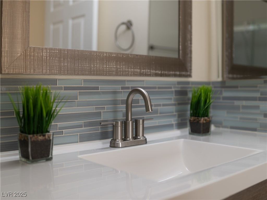 3318 North Decatur Boulevard, Unit 2149 Las Vegas, NV 89130 - Photo 6 of 26 Bathroom view of backsplash and vanity
