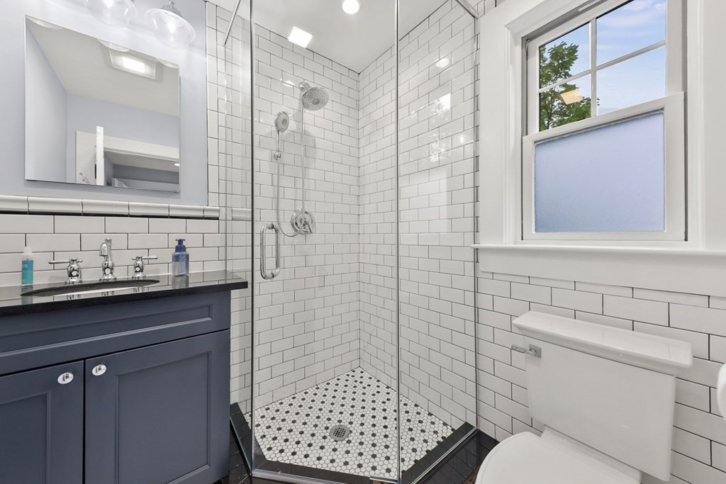 20 Columbus Avenue Beverly, MA 01915 - Photo 19 of 39 a bathroom with a sink a toilet and shower