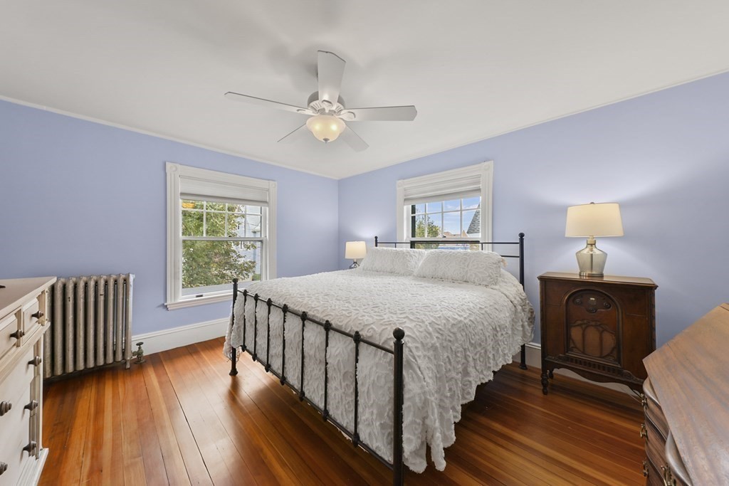 20 Columbus Avenue Beverly, MA 01915 - Photo 21 of 39 a bedroom with a bed and wooden floor
