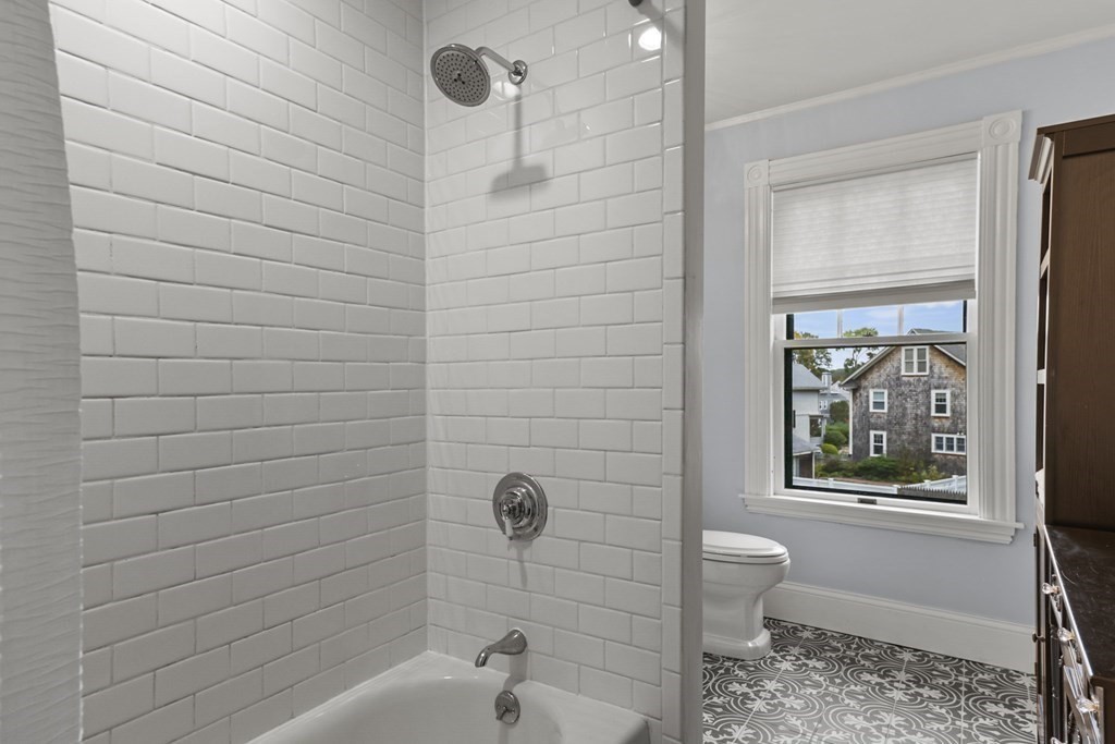 20 Columbus Avenue Beverly, MA 01915 - Photo 29 of 39 a bathroom with a bathtub and shower