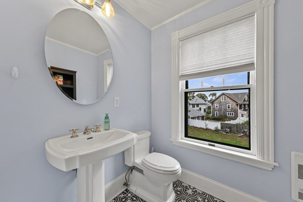 20 Columbus Avenue Beverly, MA 01915 - Photo 30 of 39 a bathroom with a toilet a sink and mirror