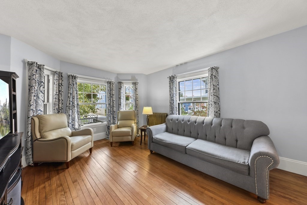 20 Columbus Avenue Beverly, MA 01915 - Photo 8 of 39 a living room with furniture and a large window