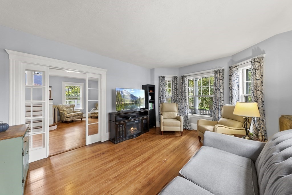 20 Columbus Avenue Beverly, MA 01915 - Photo 9 of 39 a living room with furniture and a flat screen tv