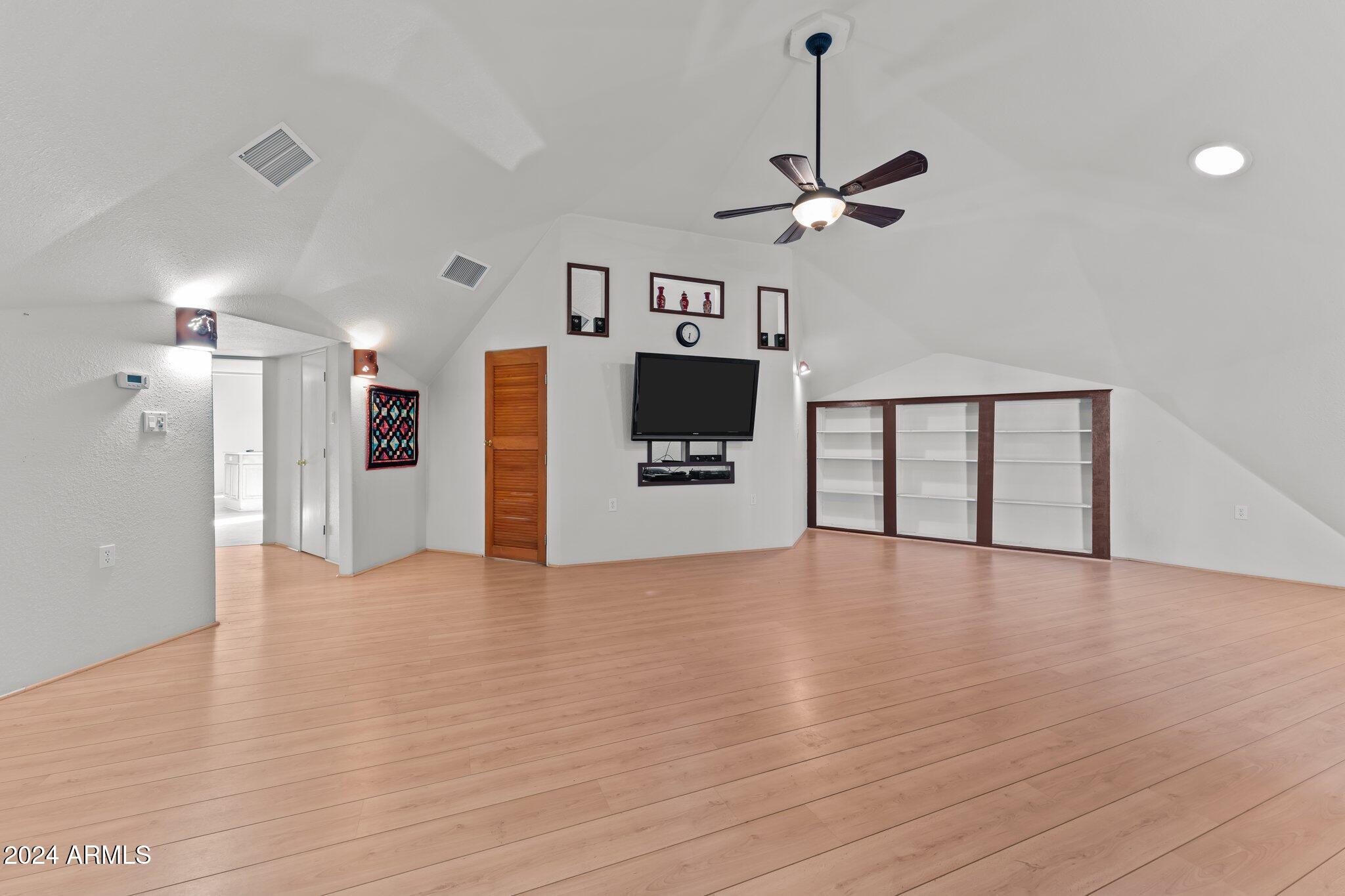 30857 Wandering Way Congress, AZ 85332 - Photo 13 of 35 a view of a kitchen with a sink and a ceiling fan