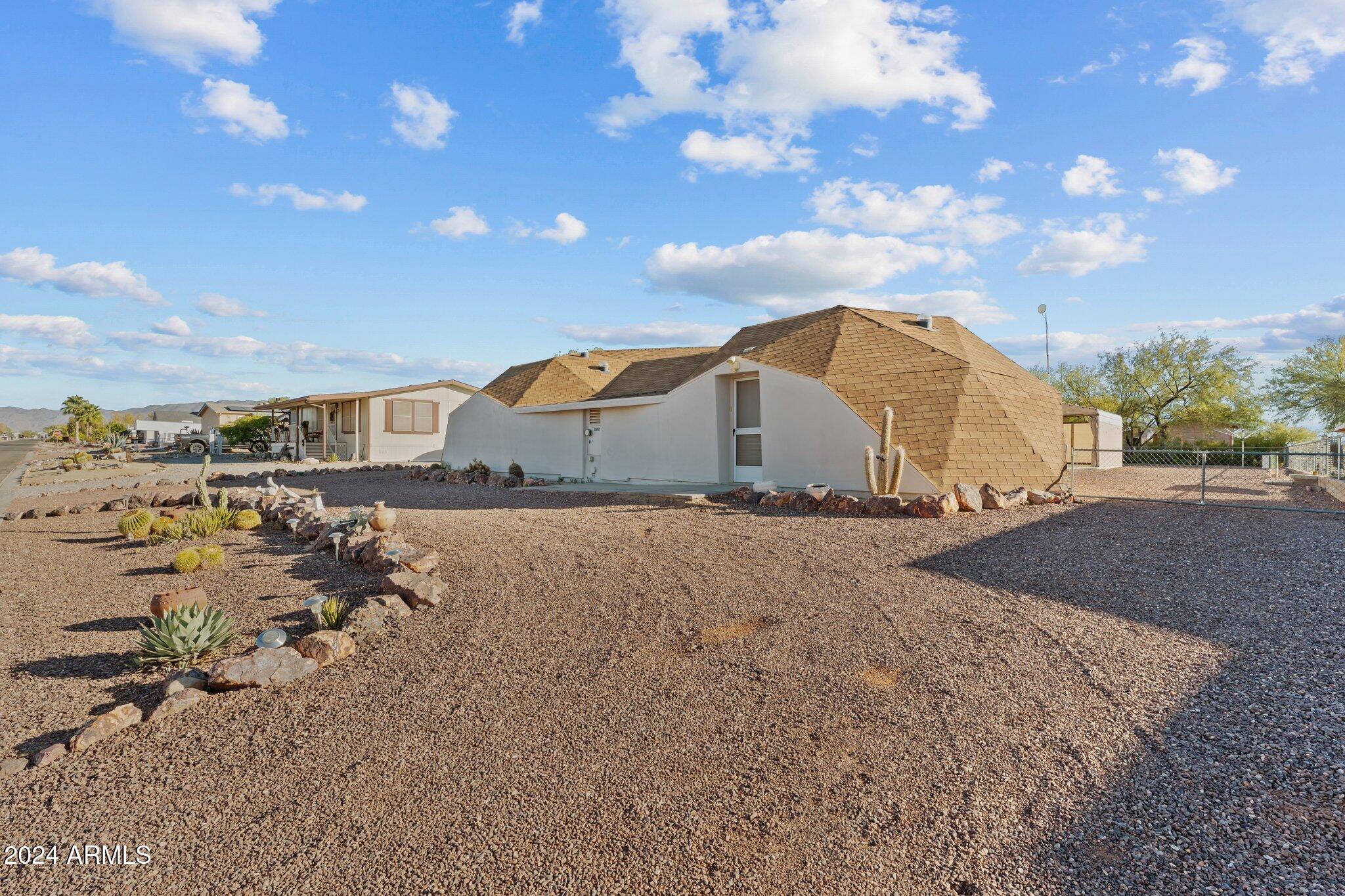 30857 Wandering Way Congress, AZ 85332 - Photo 2 of 35 a view of a house with a yard