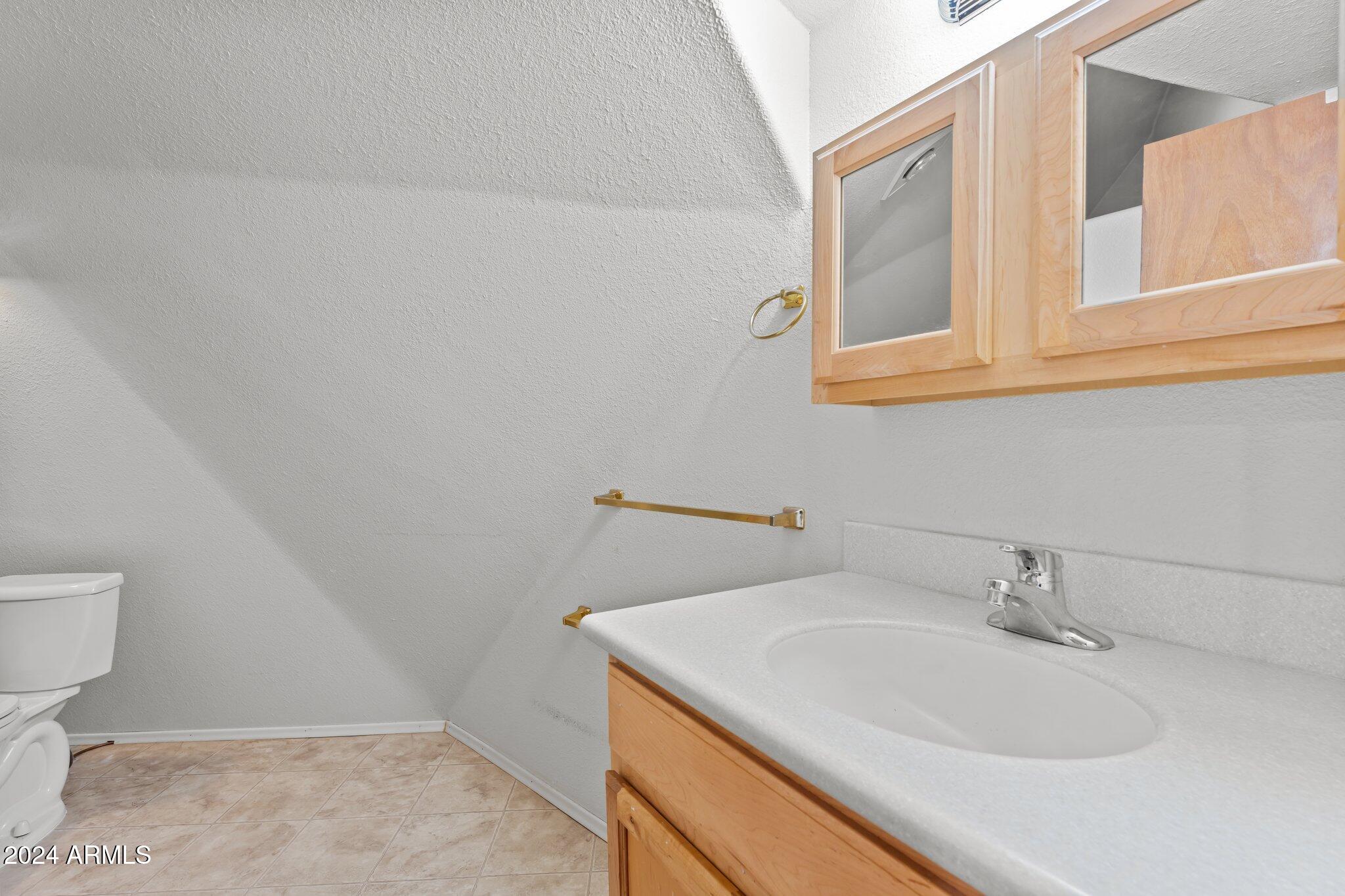 30857 Wandering Way Congress, AZ 85332 - Photo 24 of 35 a bathroom with a sink and a toilet