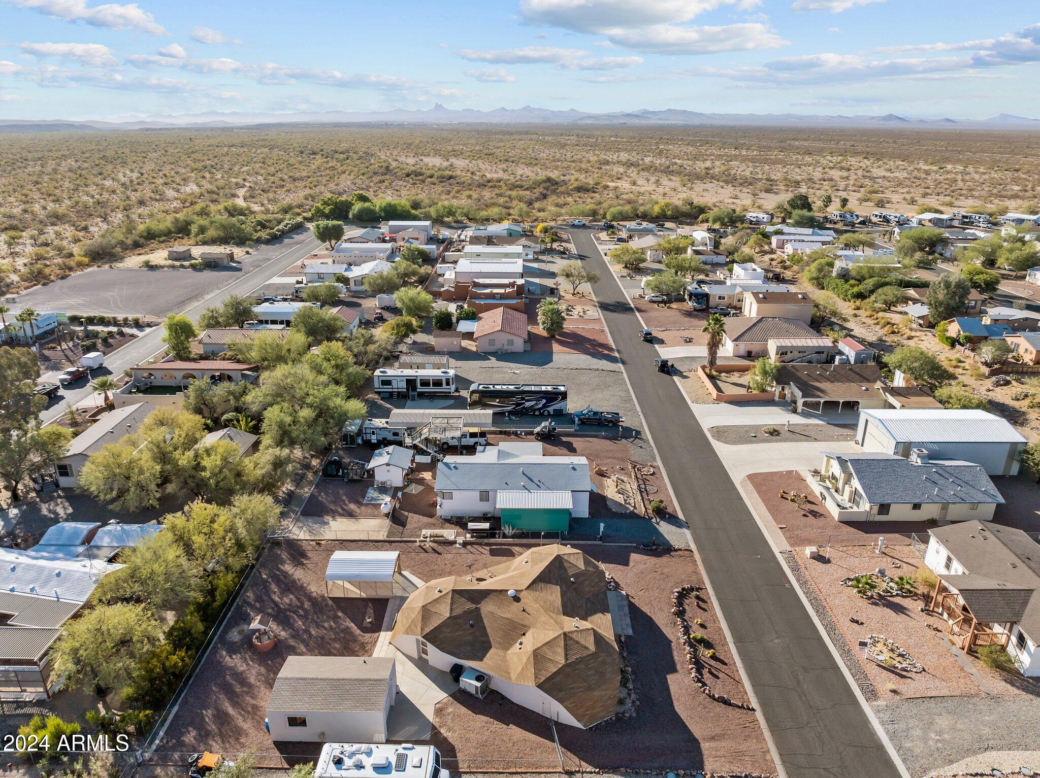 30857 Wandering Way Congress, AZ 85332 - Photo 9 of 35 an aerial view of a city with lots of residential buildings