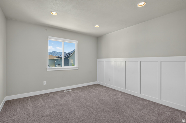 36 West Syracuse Road Vineyard, UT 84059 - Photo 36 of 56 Neutral painted walls with recessed lighting, a single window, and a white wainscoting accent wall