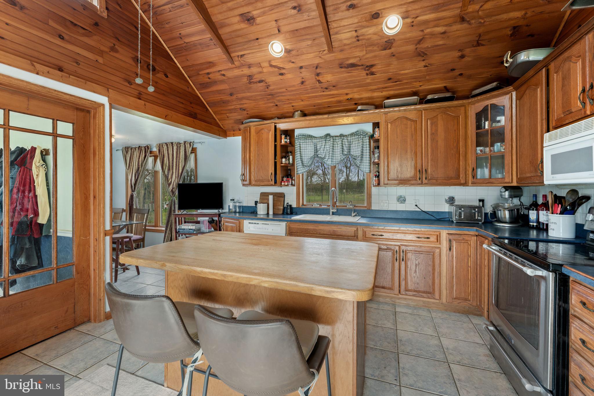 420 Russell Road Berryville, VA 22611 - Photo 26 of 60 Warm wooden kitchen with inviting charm.