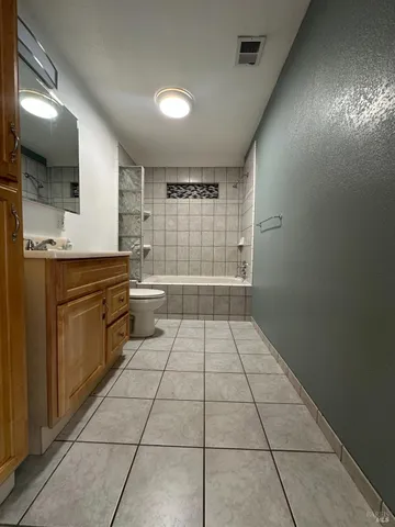 a kitchen with a cabinets and white appliances