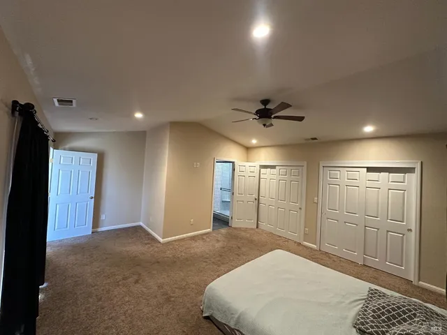 a spacious bathroom with a shower and a bathroom