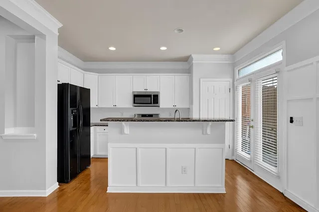 a view of balcony with wooden floor