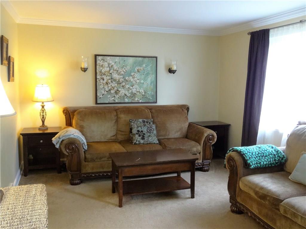 4206 Greenridge Road Pittsburgh, PA 15234 - Photo 2 of 25 Living Room with crown molding decorated in neutral colors