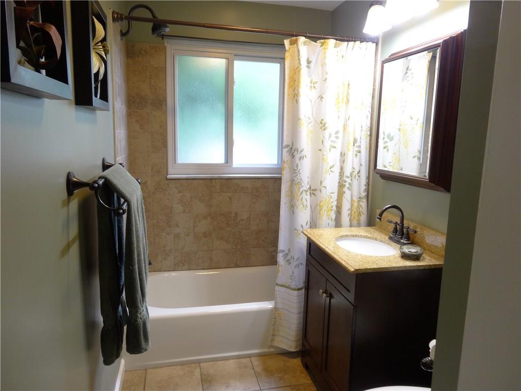 4206 Greenridge Road Pittsburgh, PA 15234 - Photo 13 of 25 Main Bath with tiled surround and granite-topped vanity