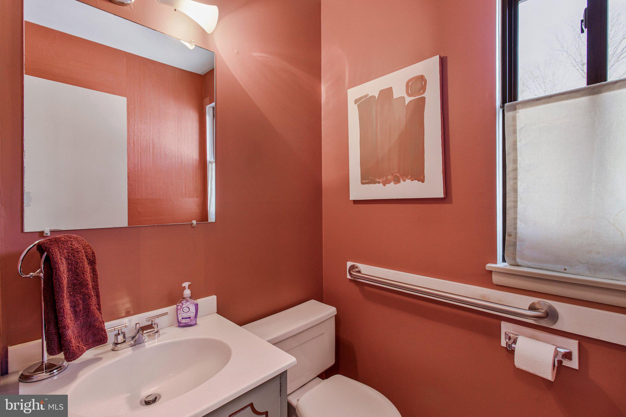 14816 Stonegate Terrace Silver Spring, MD 20905 - Photo 32 of 79 a bathroom with a sink mirror and toilet