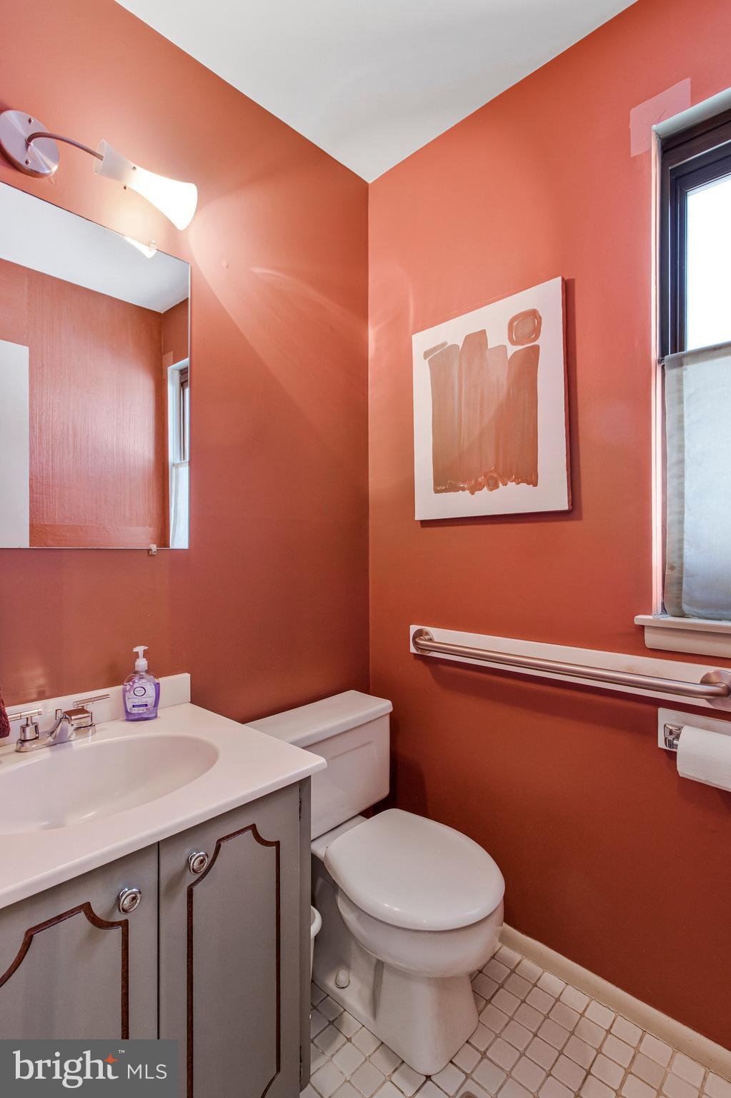 14816 Stonegate Terrace Silver Spring, MD 20905 - Photo 33 of 79 a bathroom with a sink a toilet and mirror