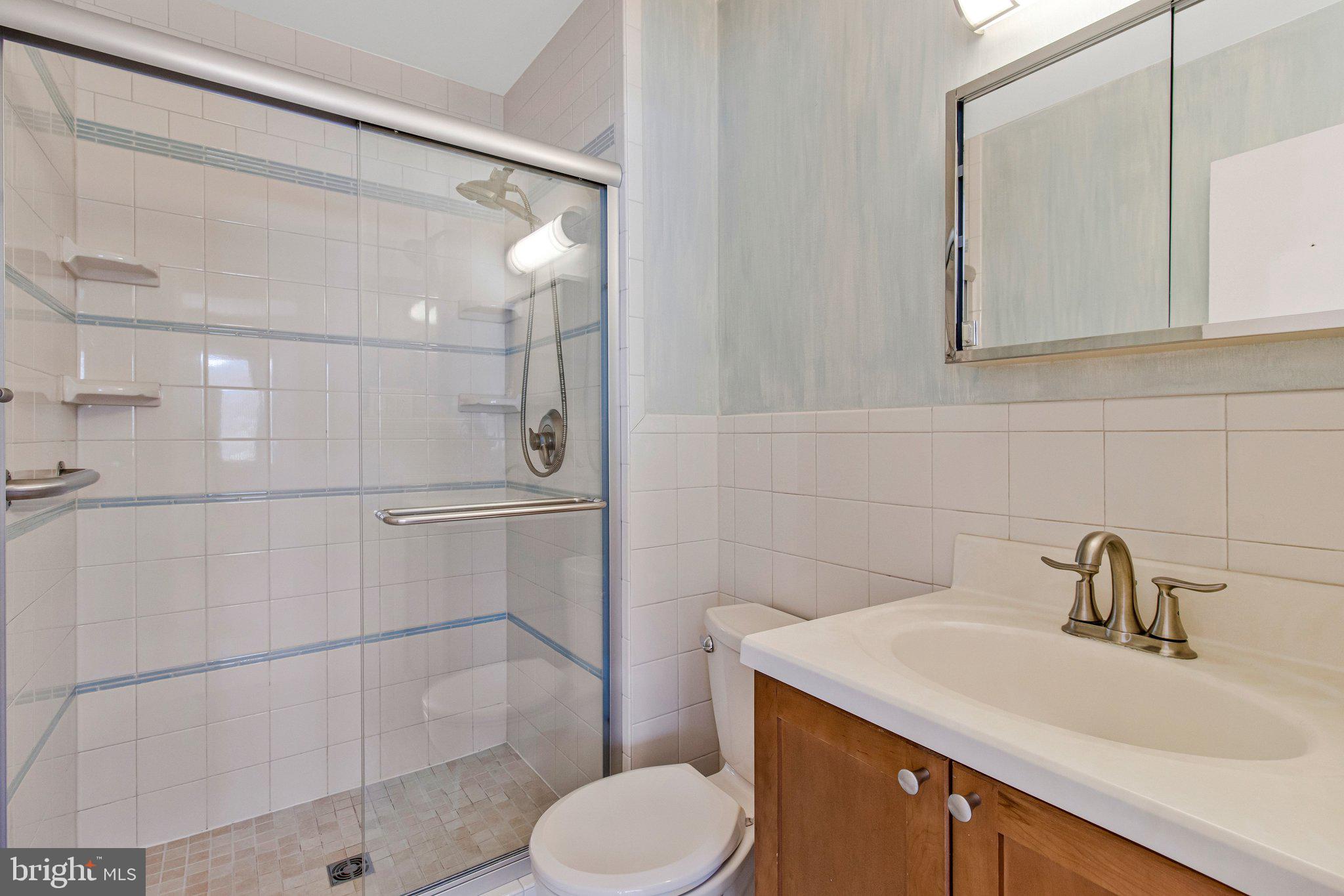 14816 Stonegate Terrace Silver Spring, MD 20905 - Photo 43 of 79 a bathroom with a sink toilet and shower