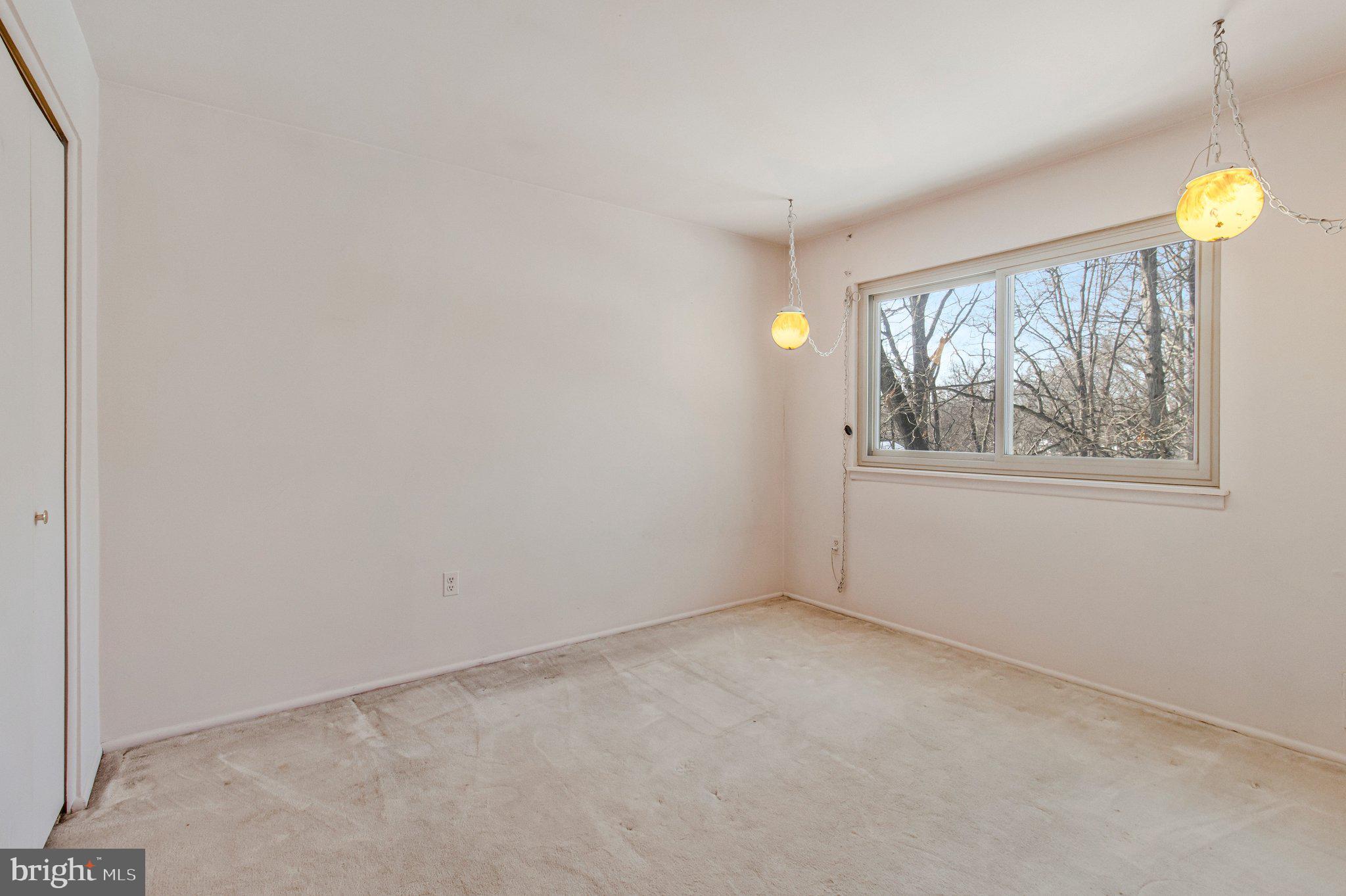 14816 Stonegate Terrace Silver Spring, MD 20905 - Photo 47 of 79 wooden floor in an empty room with a window