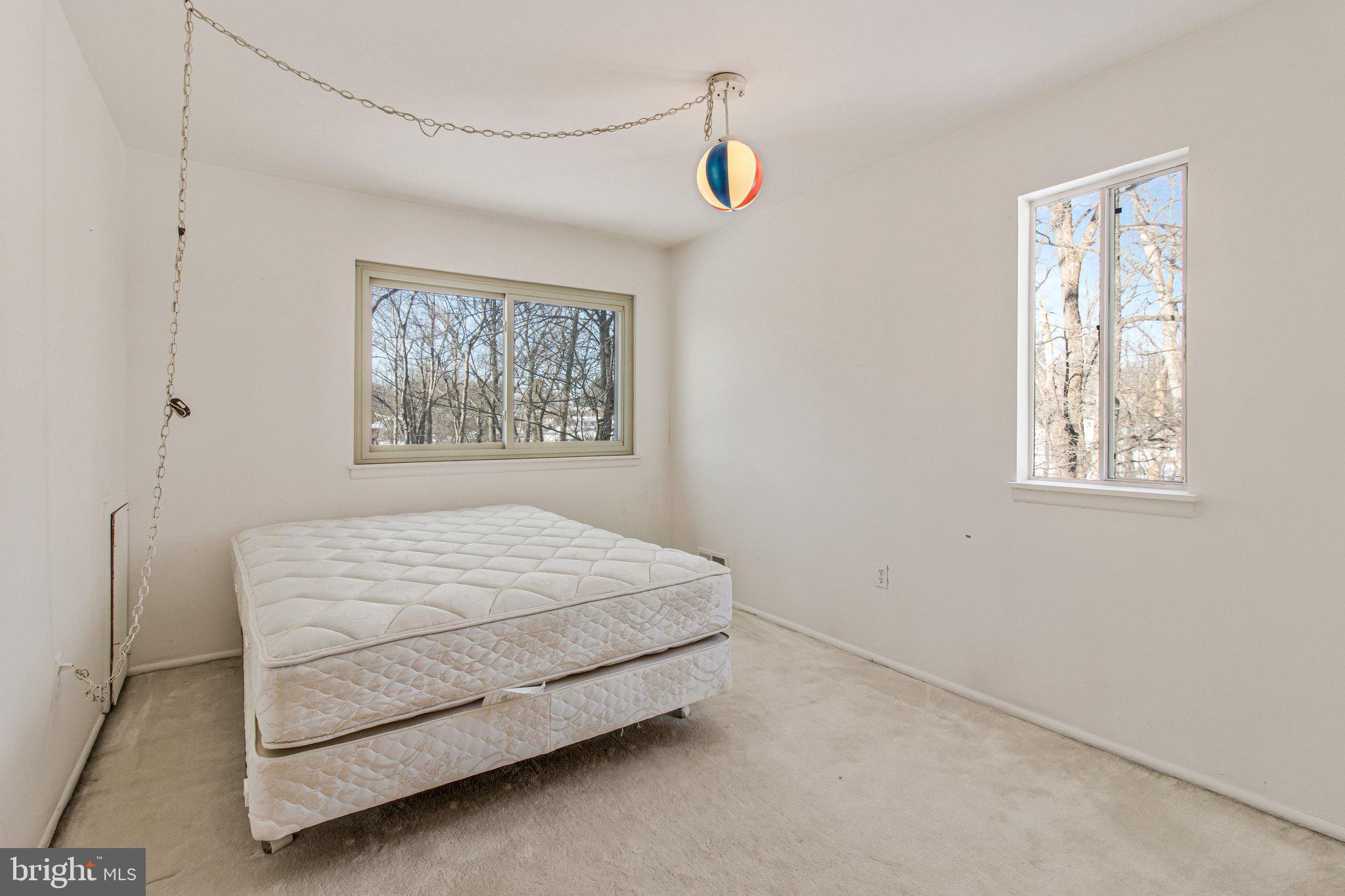 14816 Stonegate Terrace Silver Spring, MD 20905 - Photo 52 of 79 a room with a bed and a window