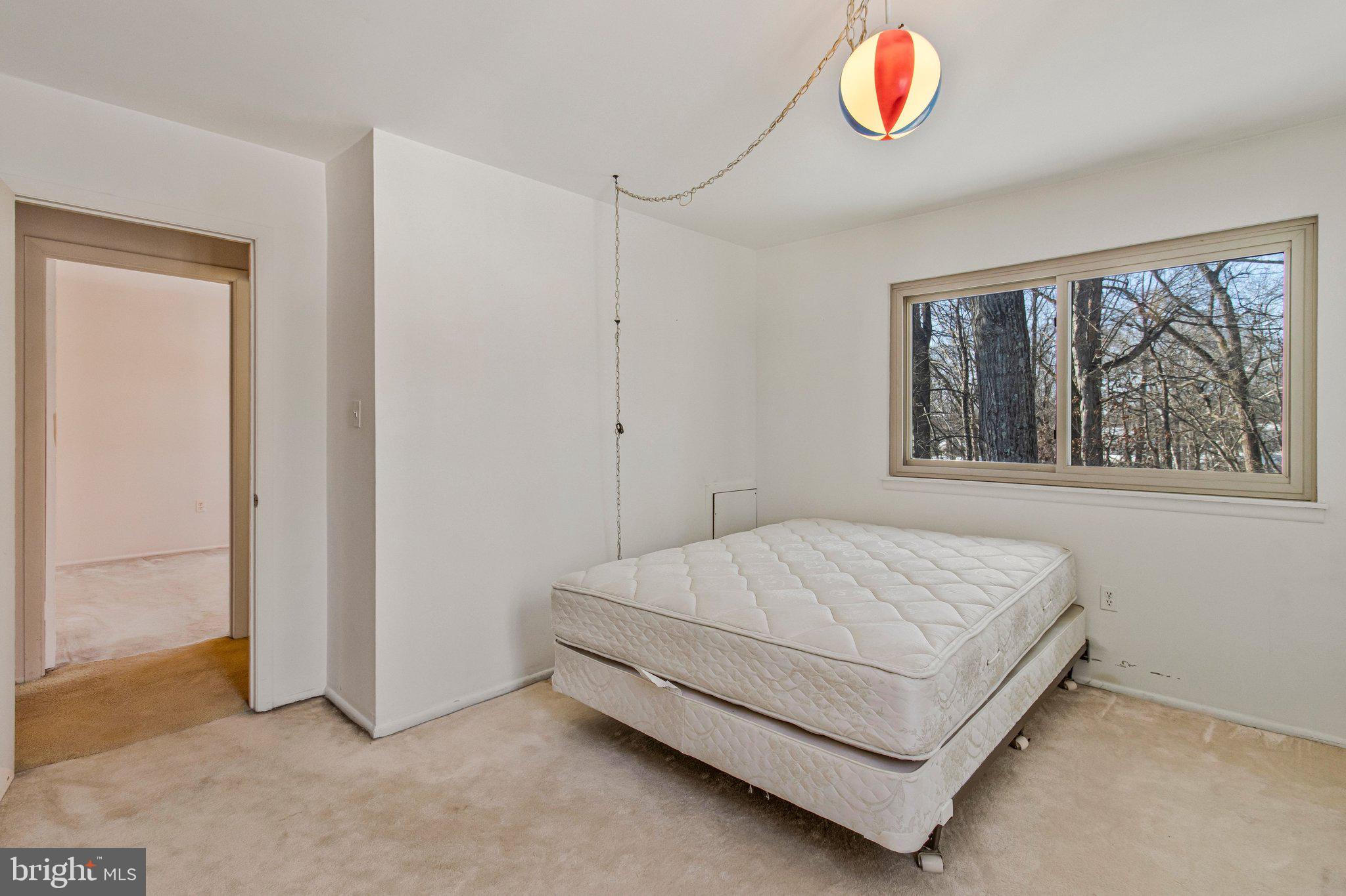 14816 Stonegate Terrace Silver Spring, MD 20905 - Photo 53 of 79 a bedroom with a bed and a window