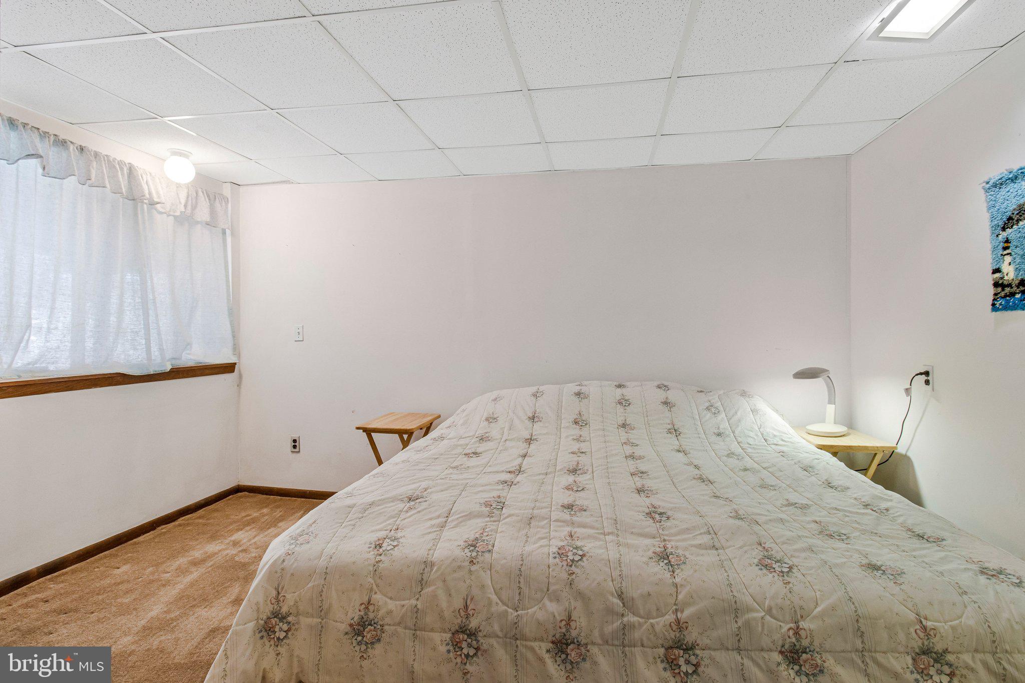 14816 Stonegate Terrace Silver Spring, MD 20905 - Photo 61 of 79 a bedroom with a bed and a window
