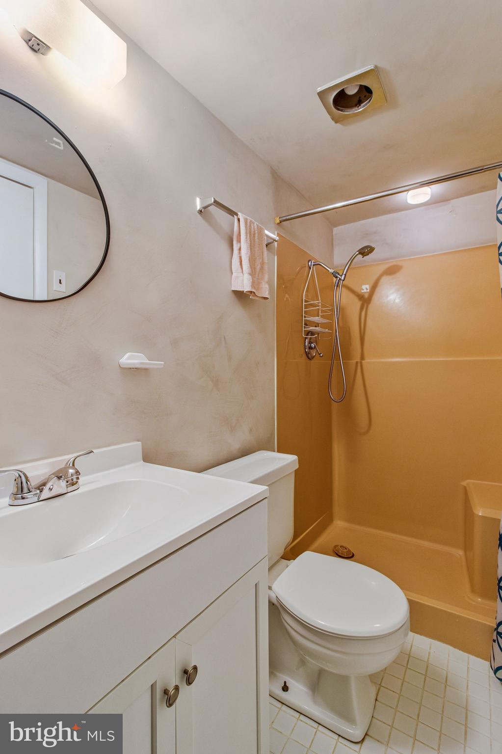 14816 Stonegate Terrace Silver Spring, MD 20905 - Photo 62 of 79 a bathroom with a sink a toilet and shower
