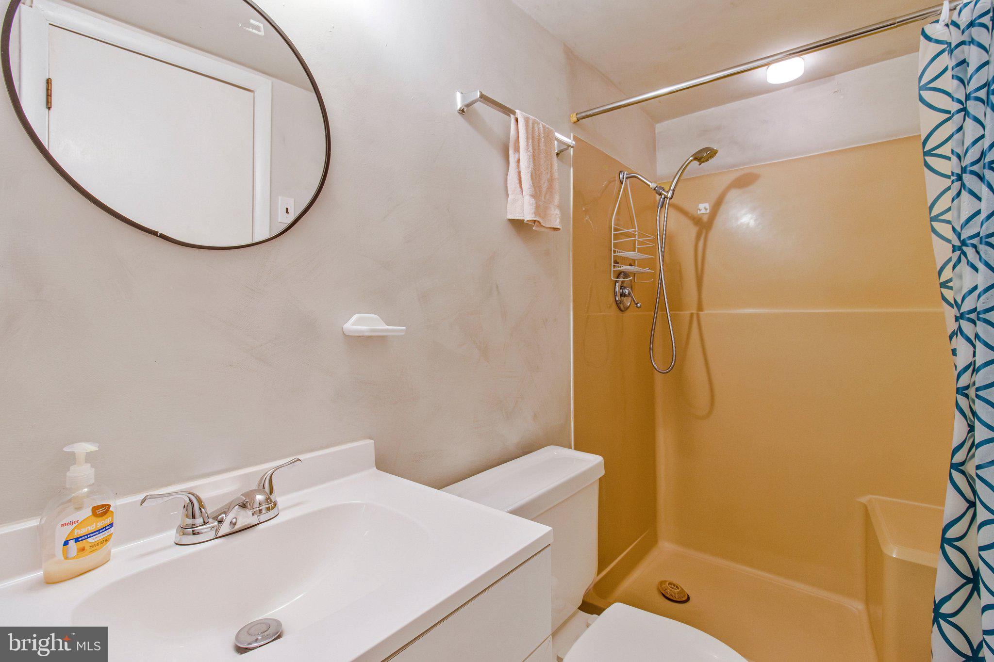 14816 Stonegate Terrace Silver Spring, MD 20905 - Photo 64 of 79 a bathroom with a sink and a mirror