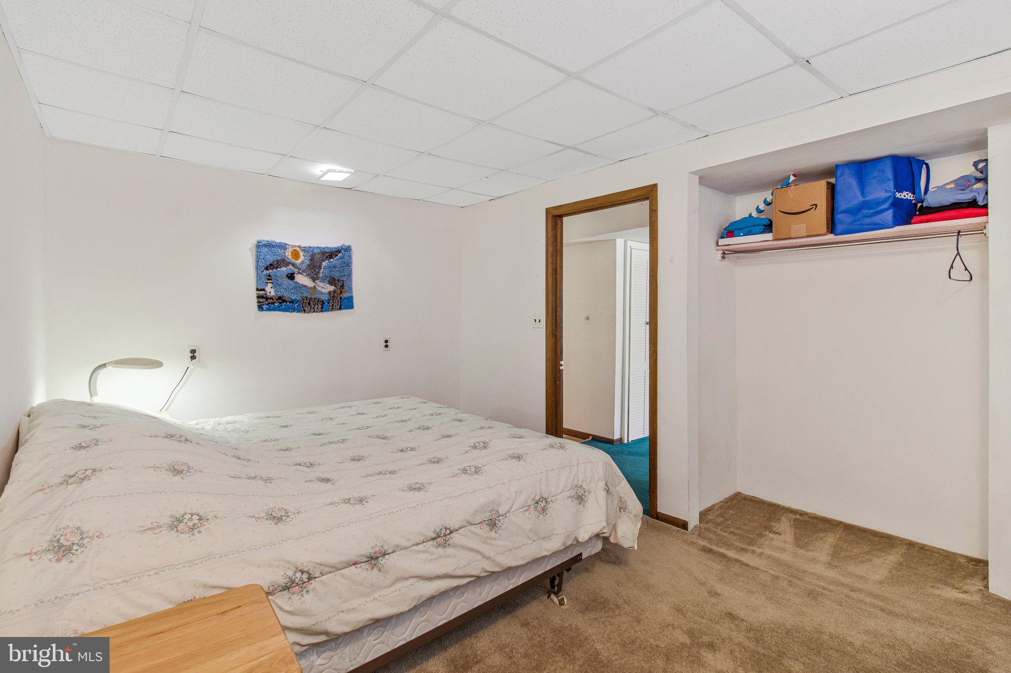 14816 Stonegate Terrace Silver Spring, MD 20905 - Photo 65 of 79 a bedroom with a bed and a cabinets