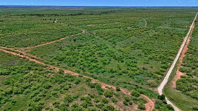 a view of a field with an outdoor space