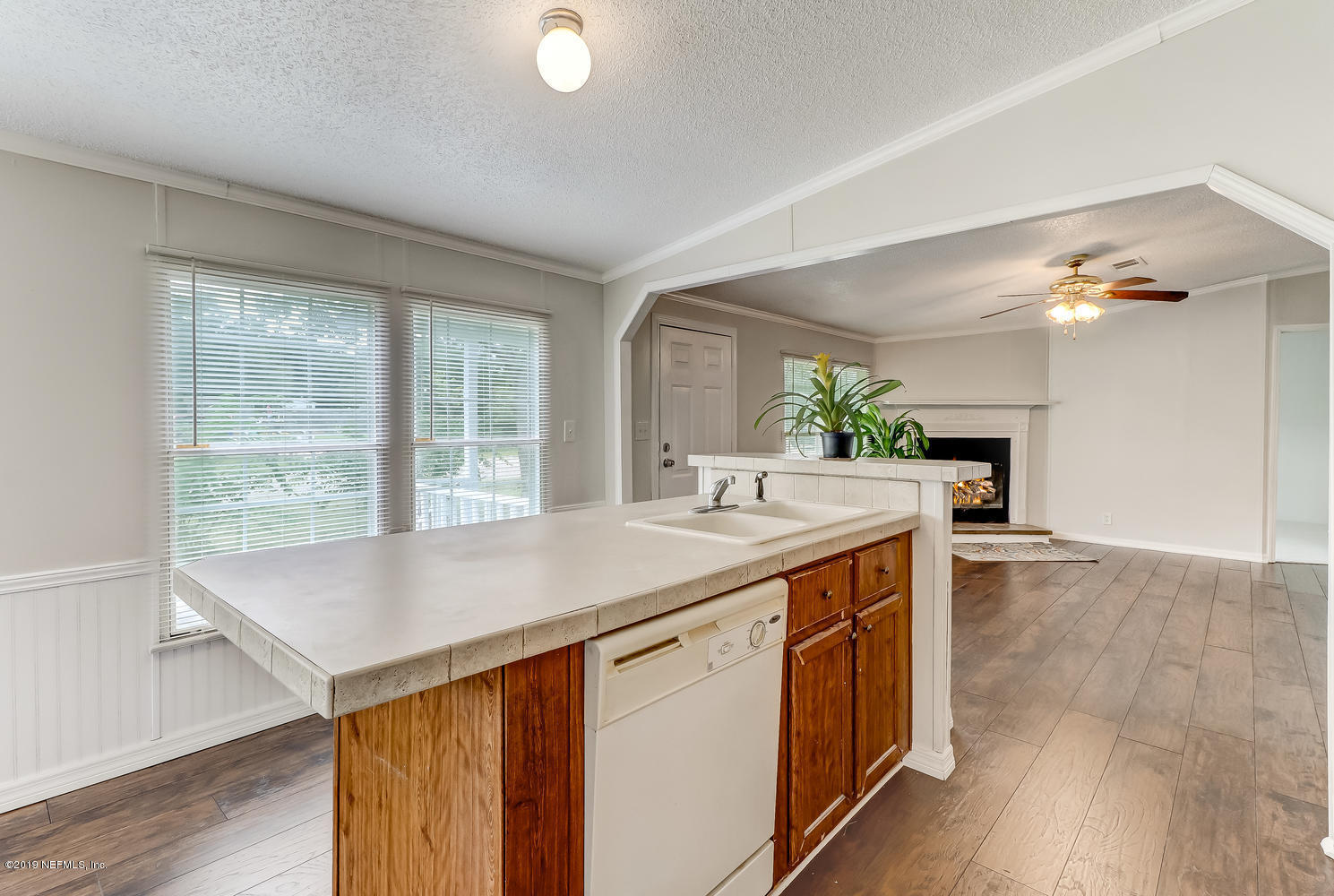 85354 Winona Bayview Road Yulee, FL 32097 - Photo 12 of 27 a kitchen with a sink and large window