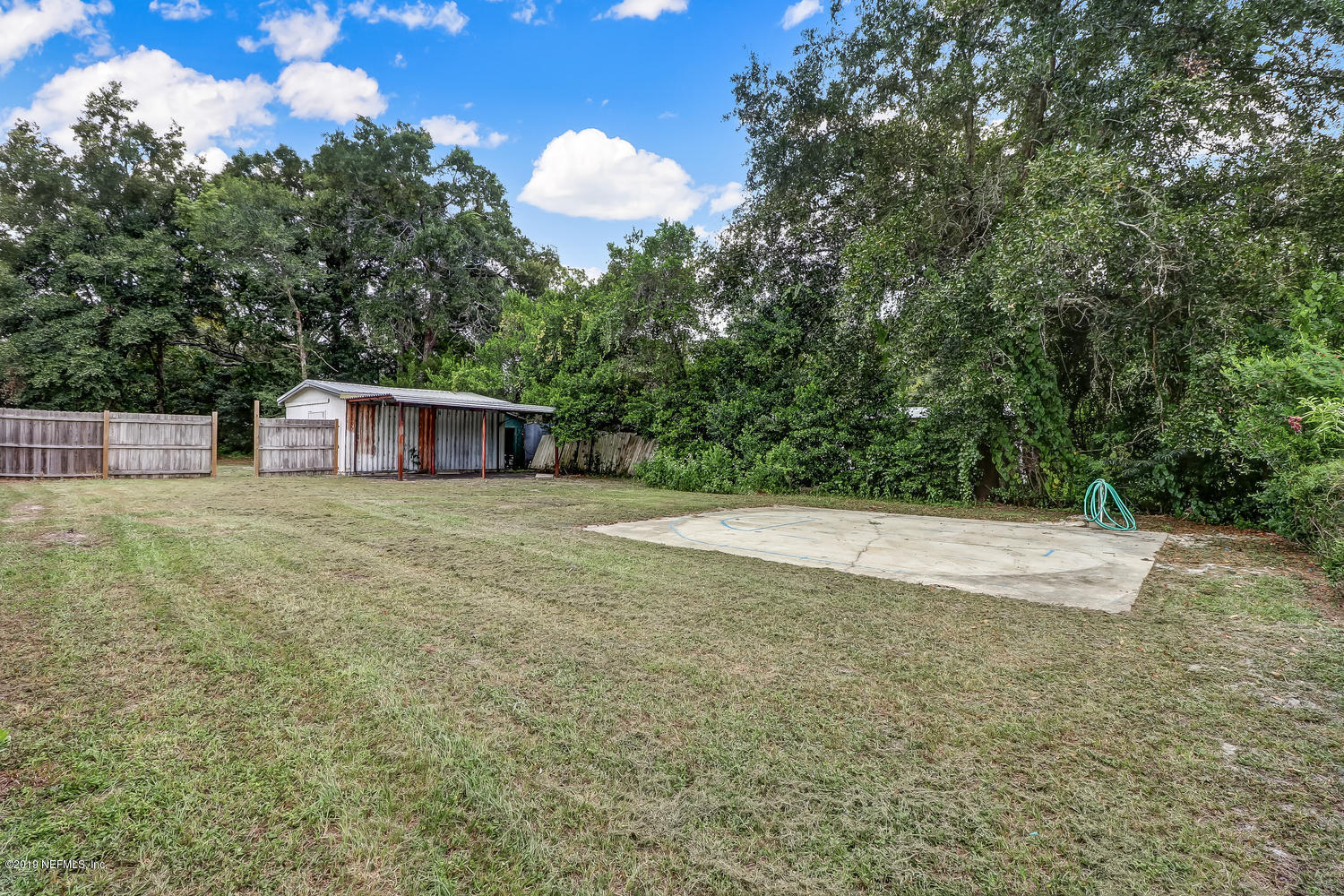 85354 Winona Bayview Road Yulee, FL 32097 - Photo 26 of 27 a view of a house with a backyard