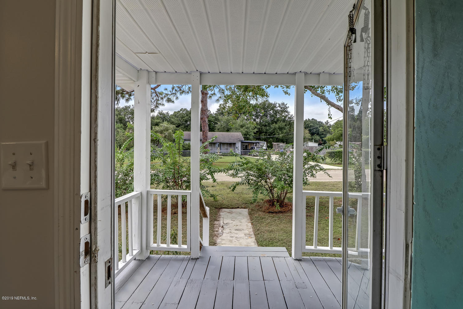 85354 Winona Bayview Road Yulee, FL 32097 - Photo 5 of 27 a view of a wooden deck and a yard