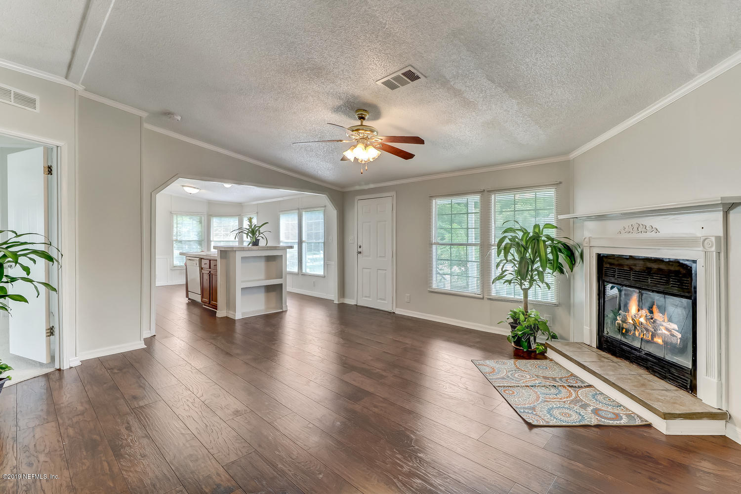 85354 Winona Bayview Road Yulee, FL 32097 - Photo 8 of 27 a view of an empty room with fire place and a fireplace