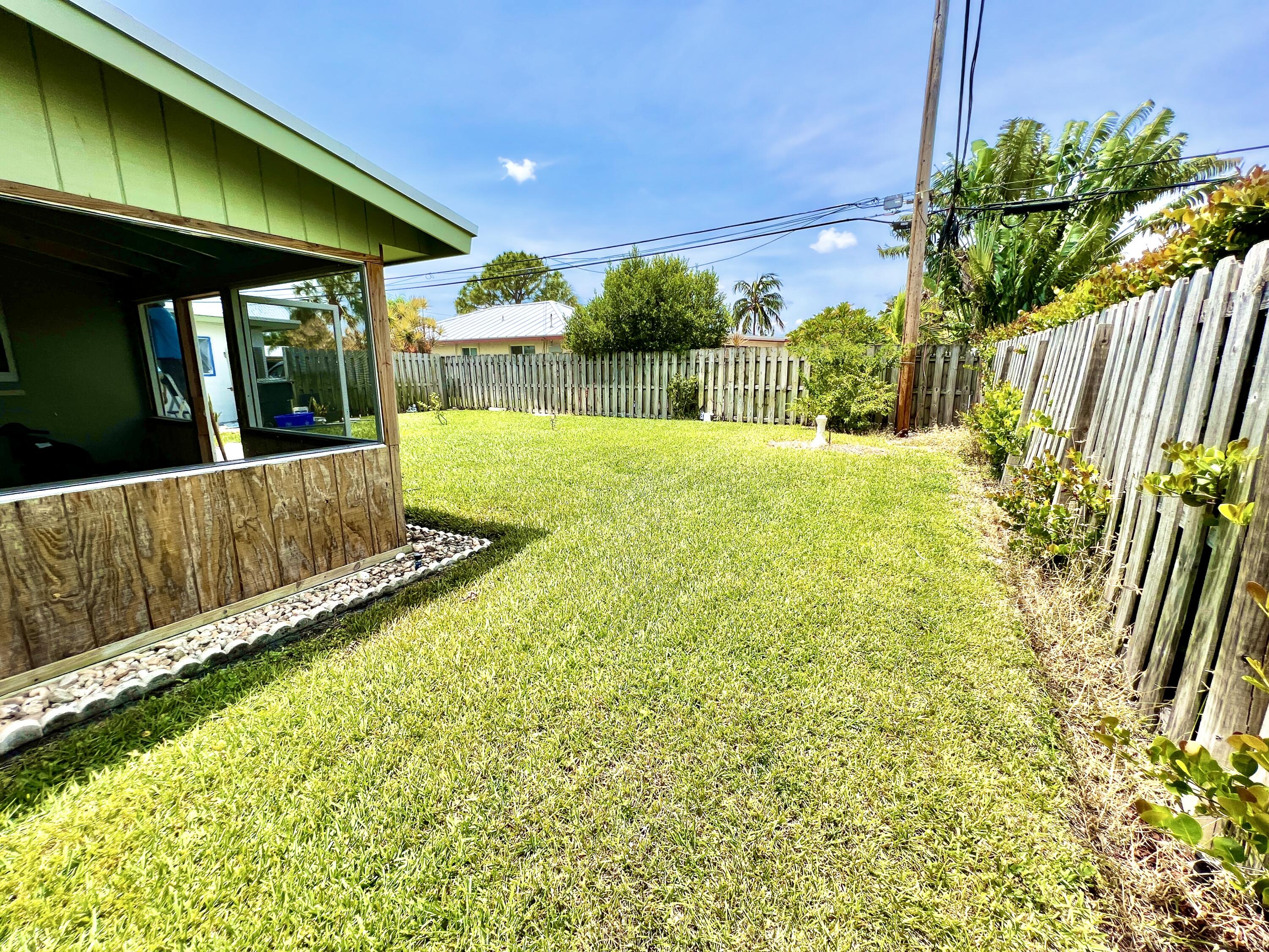 381 Northeast 28th Terrace Boca Raton, FL 33431 - Photo 44 of 56 Large Side Yard and Screened Porch