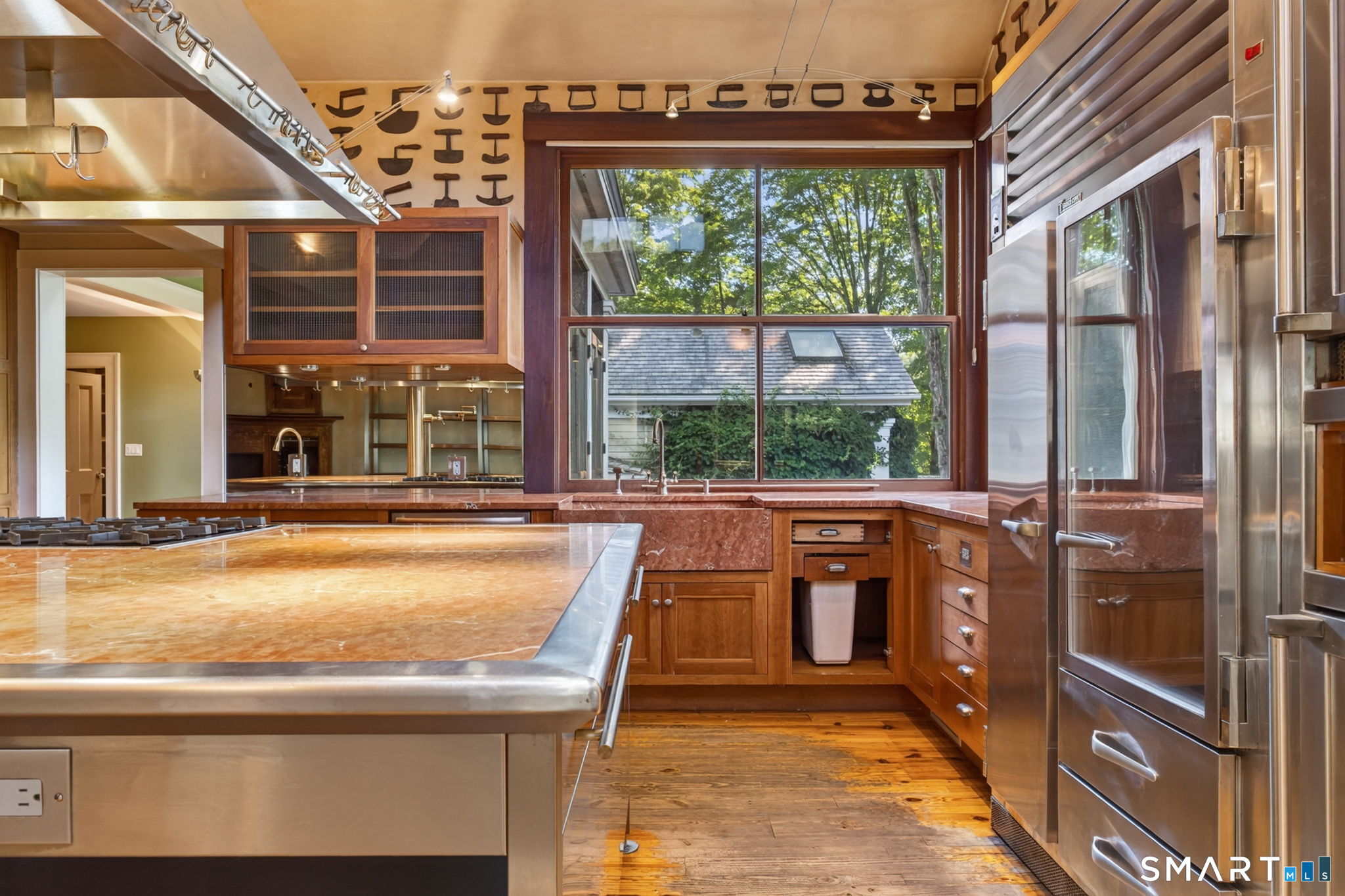 2 Rowland Road Old Lyme, CT 06371 - Photo 6 of 40 A large granite sink sits below large custom windows that creates an open air feel when opened.