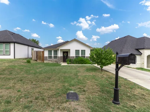 a house view with a garden space