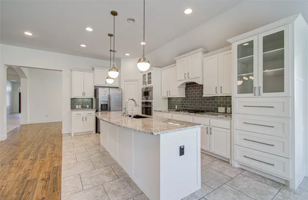 a large kitchen with cabinets