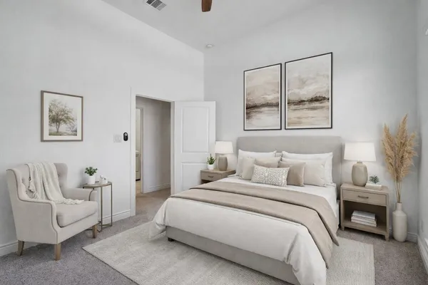 a bedroom with a bed and a couch