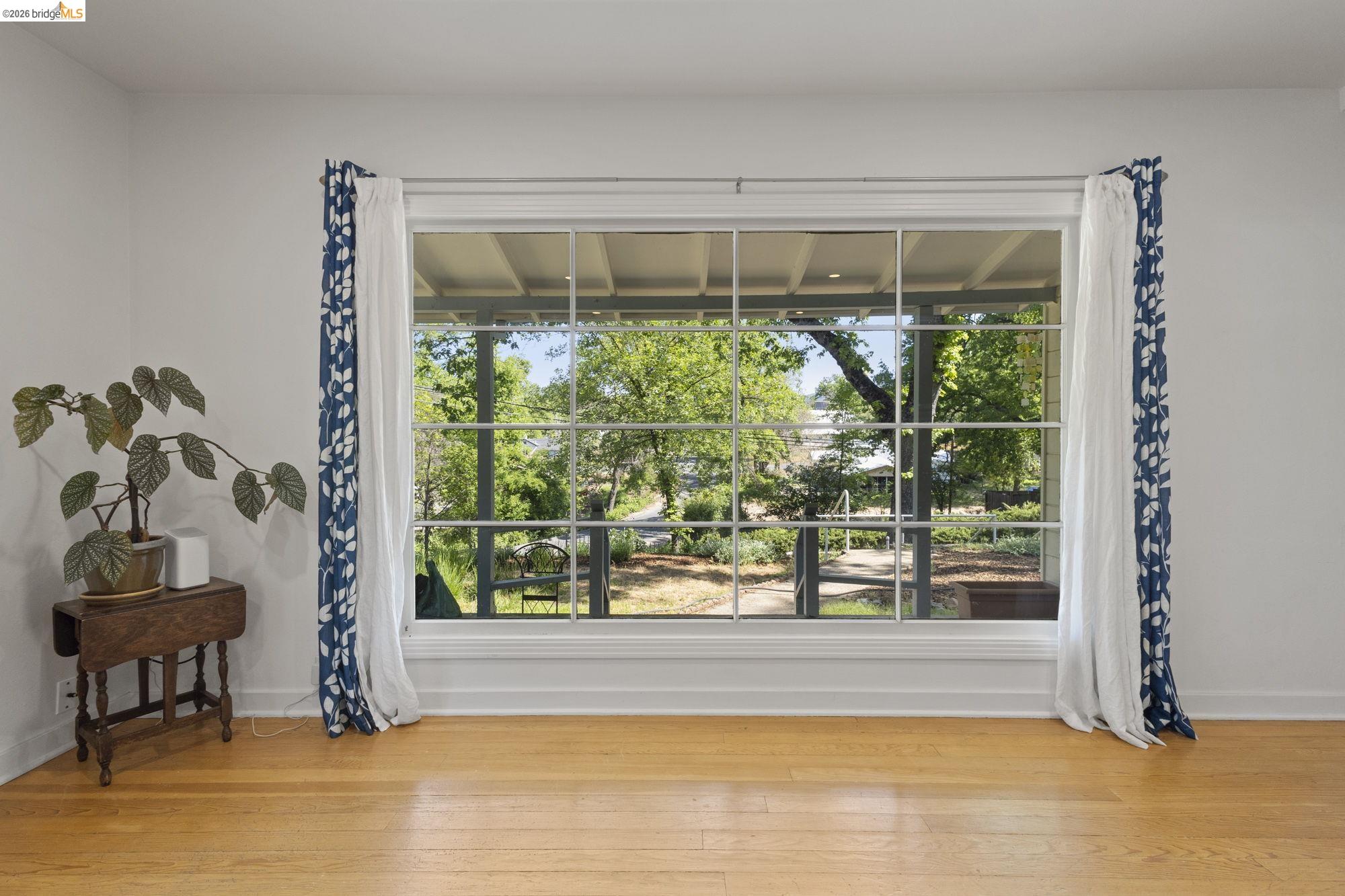 18363 Yosemite Road Tuolumne, CA 95379 - Photo 9 of 34 Large picture window with grid detailing, offering an expansive outdoor scene