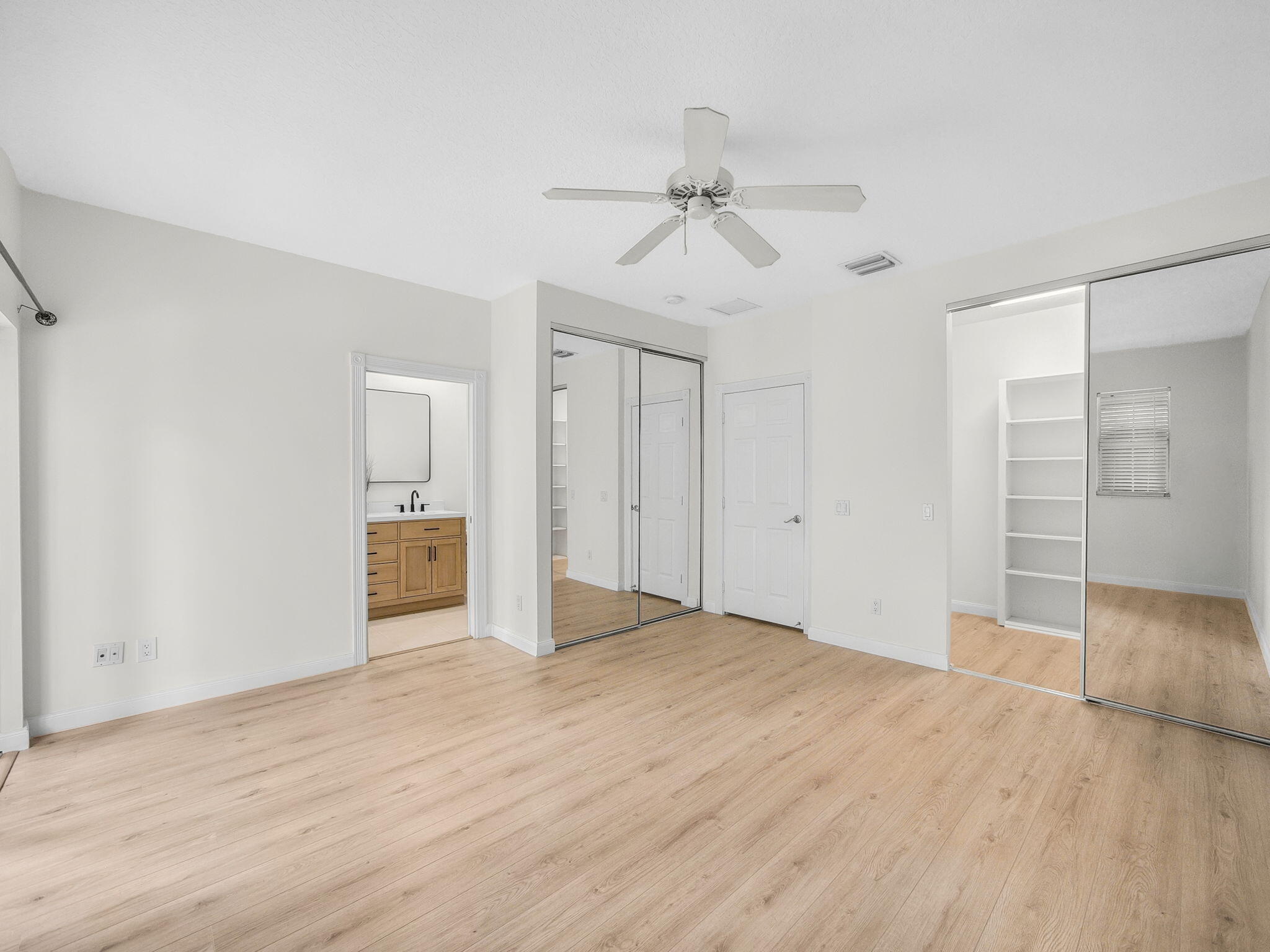 3119 East Community Drive Jupiter, FL 33458 - Photo 6 of 24 wooden floor in an empty room