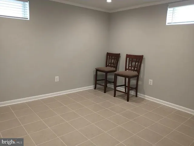 a room with a bench and a table in it